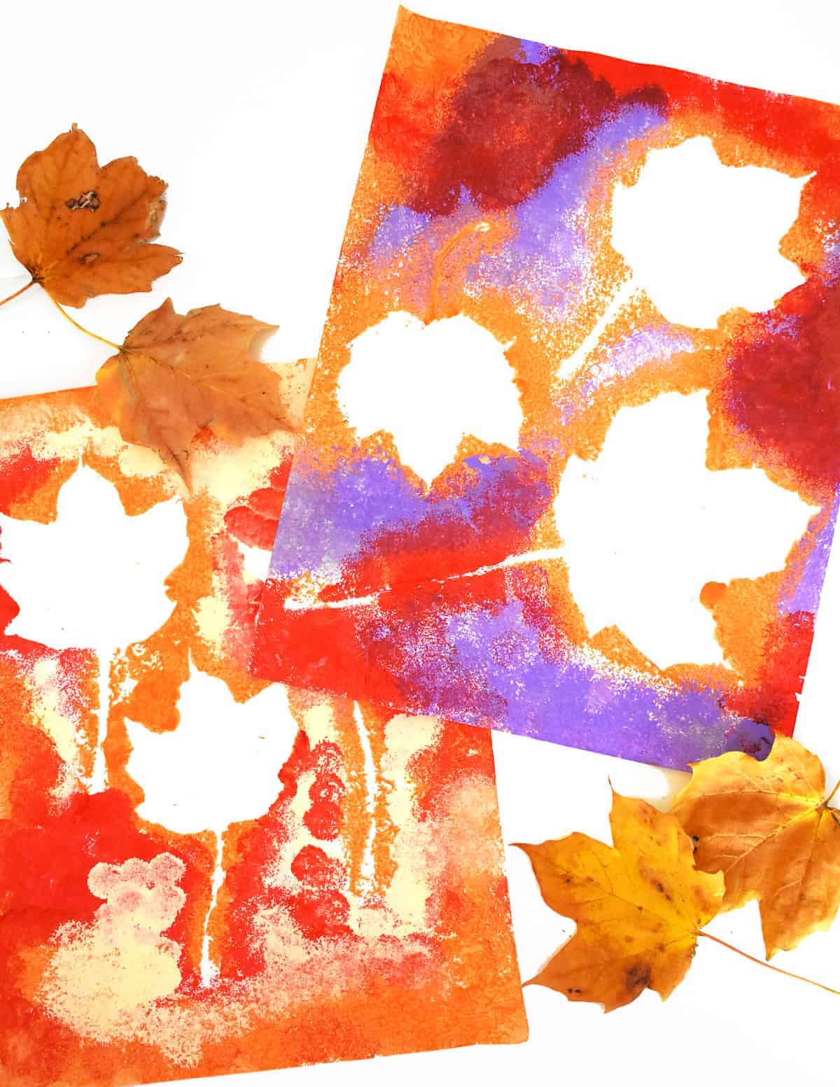 Fall Leaf Pom Pom Art with leaves next to it on white background