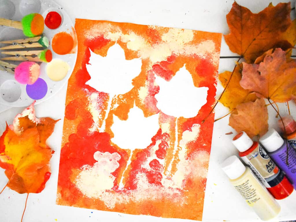 Fall Leaf Pom Pom Art with supplies laying next to it