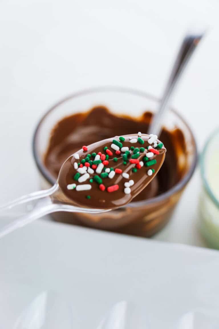 Plastic spoon with chocolate and sprinkles on it for hot chocolate spoons