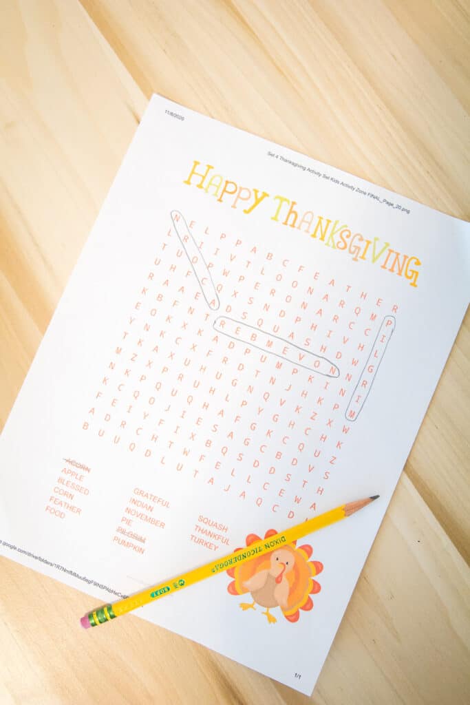 Thanksgiving Word Search Laying on a wooden desk with pencil top.