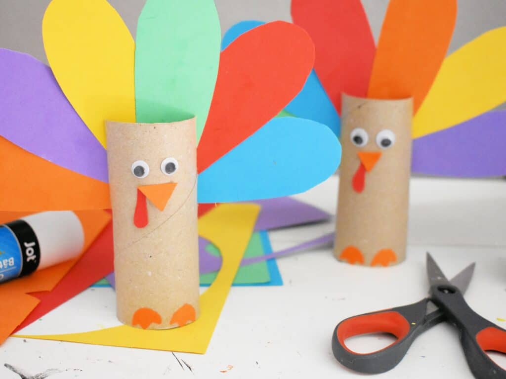 Two Toilet Paper Craft Turkeys sitting next to each other.