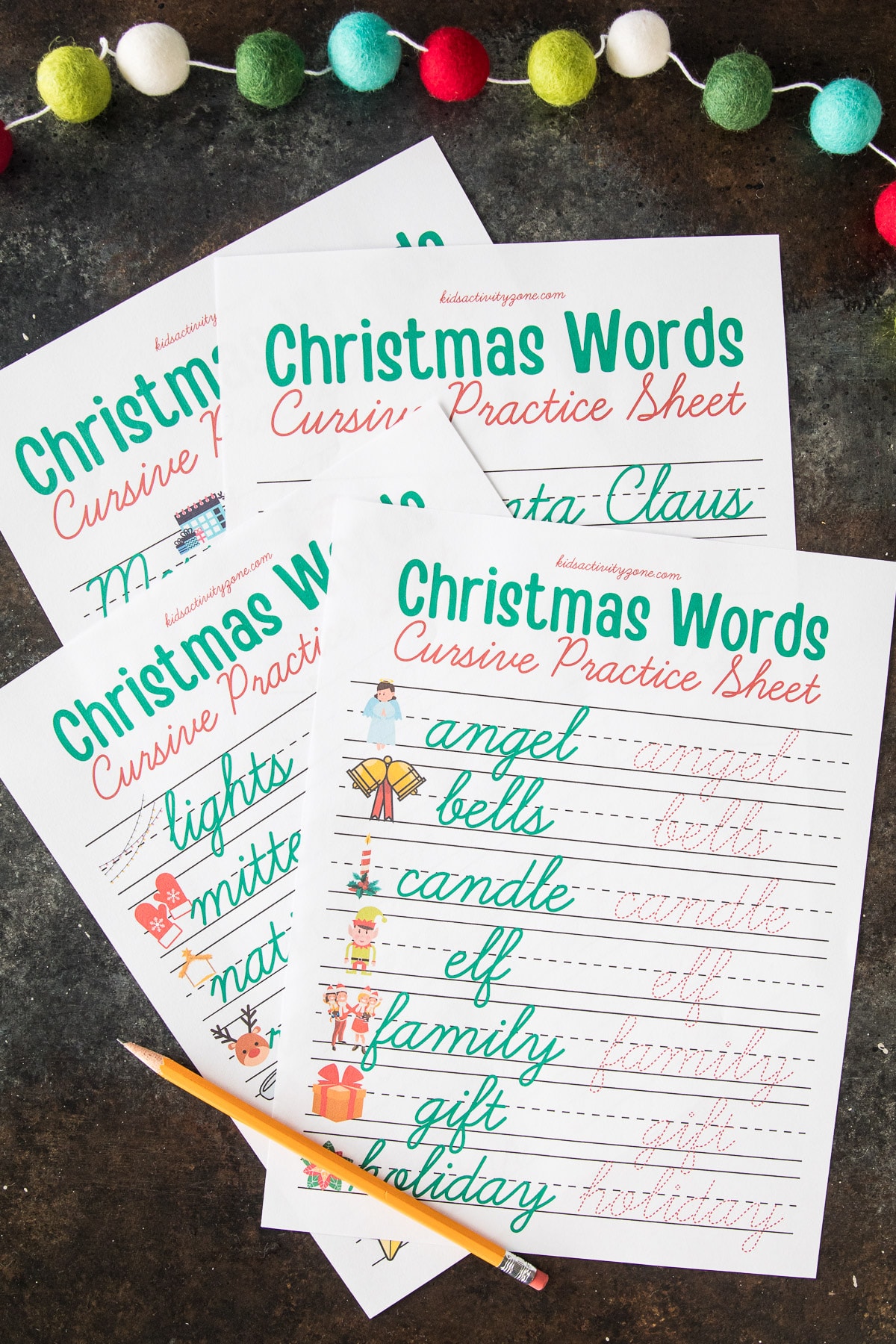 Set of four Christmas Cursive Words Worksheets on dark background