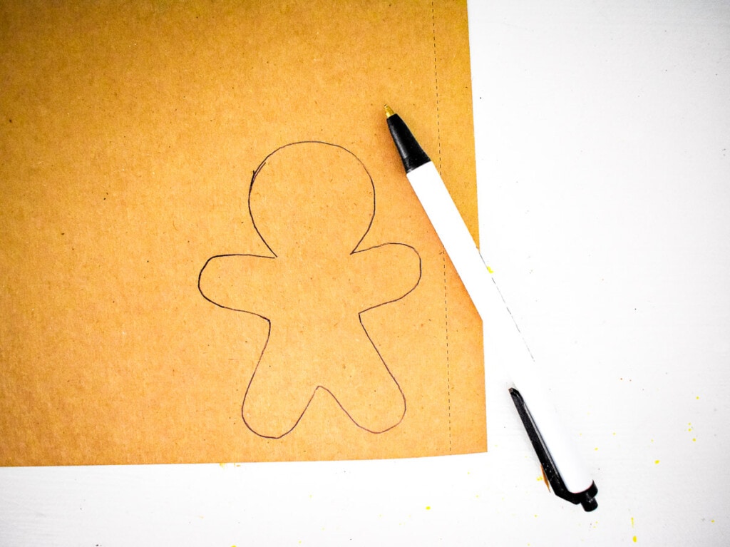 Gingerbread man outline traced on brown paper