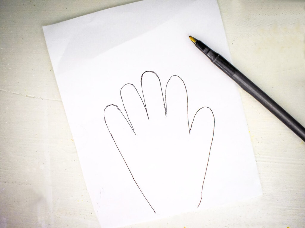 White paper with child's handprints traced on it