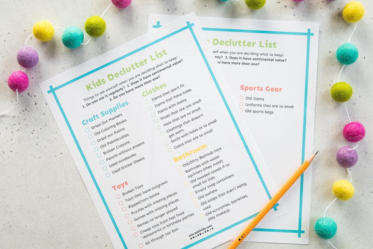 Kids Declutter List on light background with pom poms