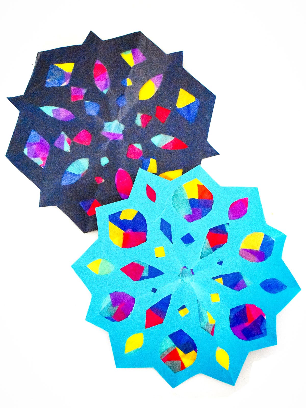 Two Snowflake Suncatchers overlapping on a white background