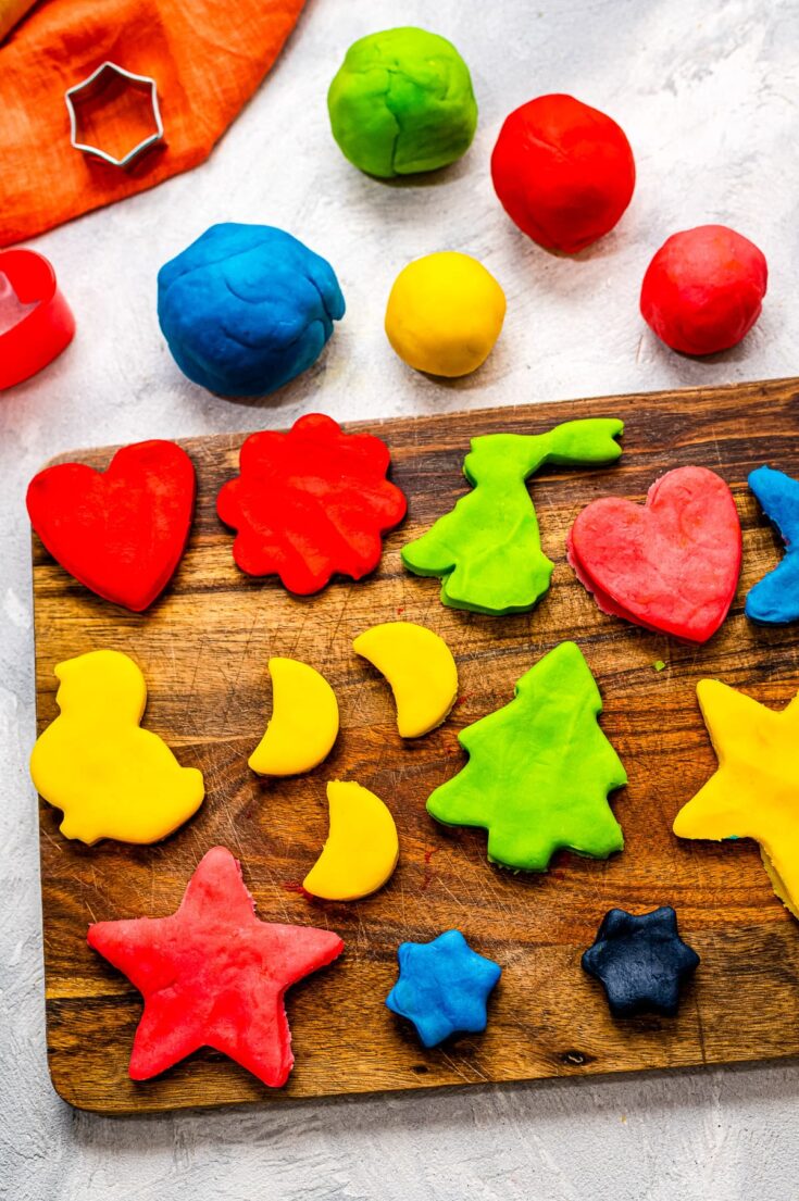 Playdough cut outs on cutting board