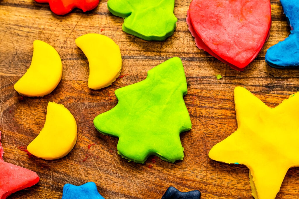 Moons, christmas trees, hearts, star shapes cut out of playdough.