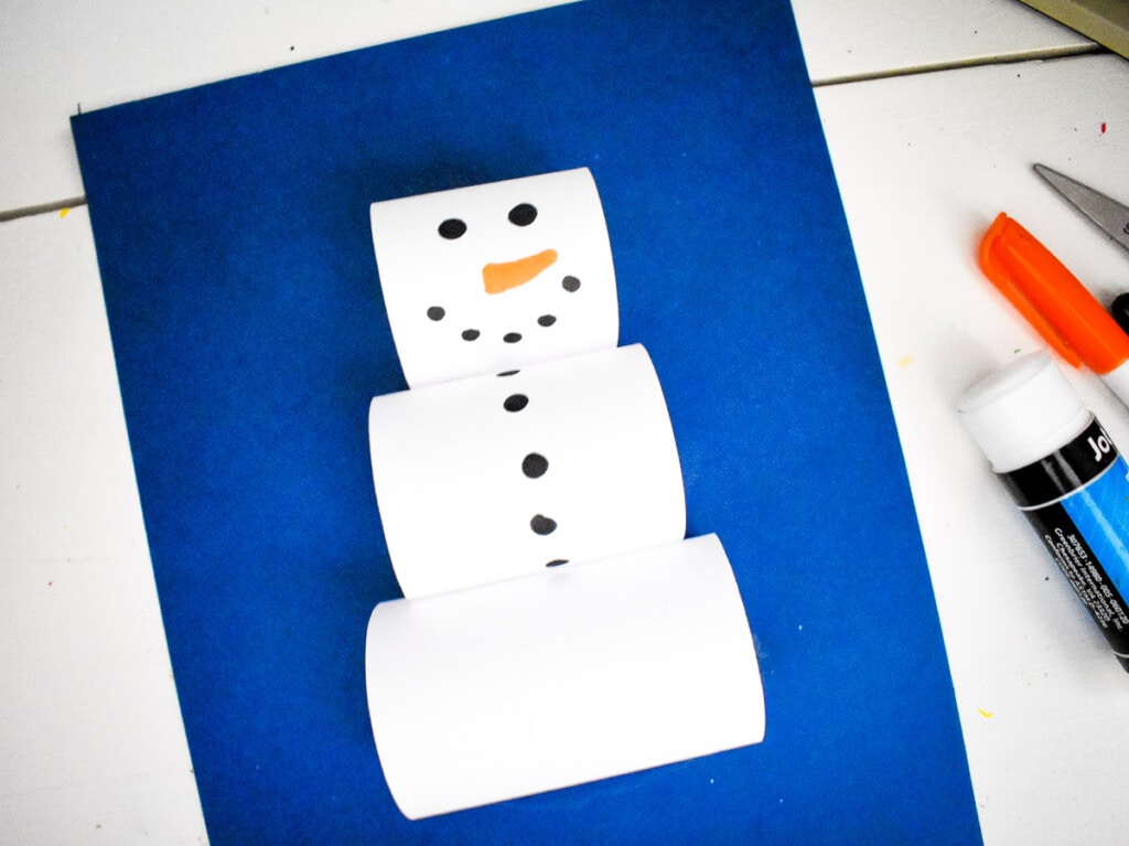 Three Paper Loops Snowman on blue paper