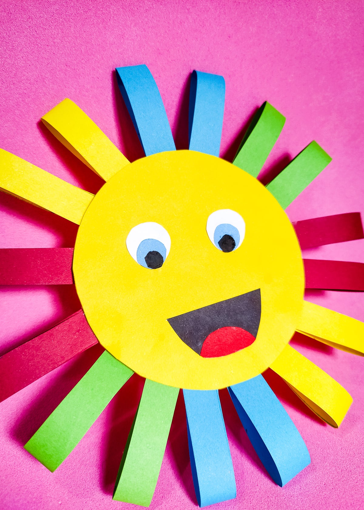 Rainbow Sun Craft on bright pink background