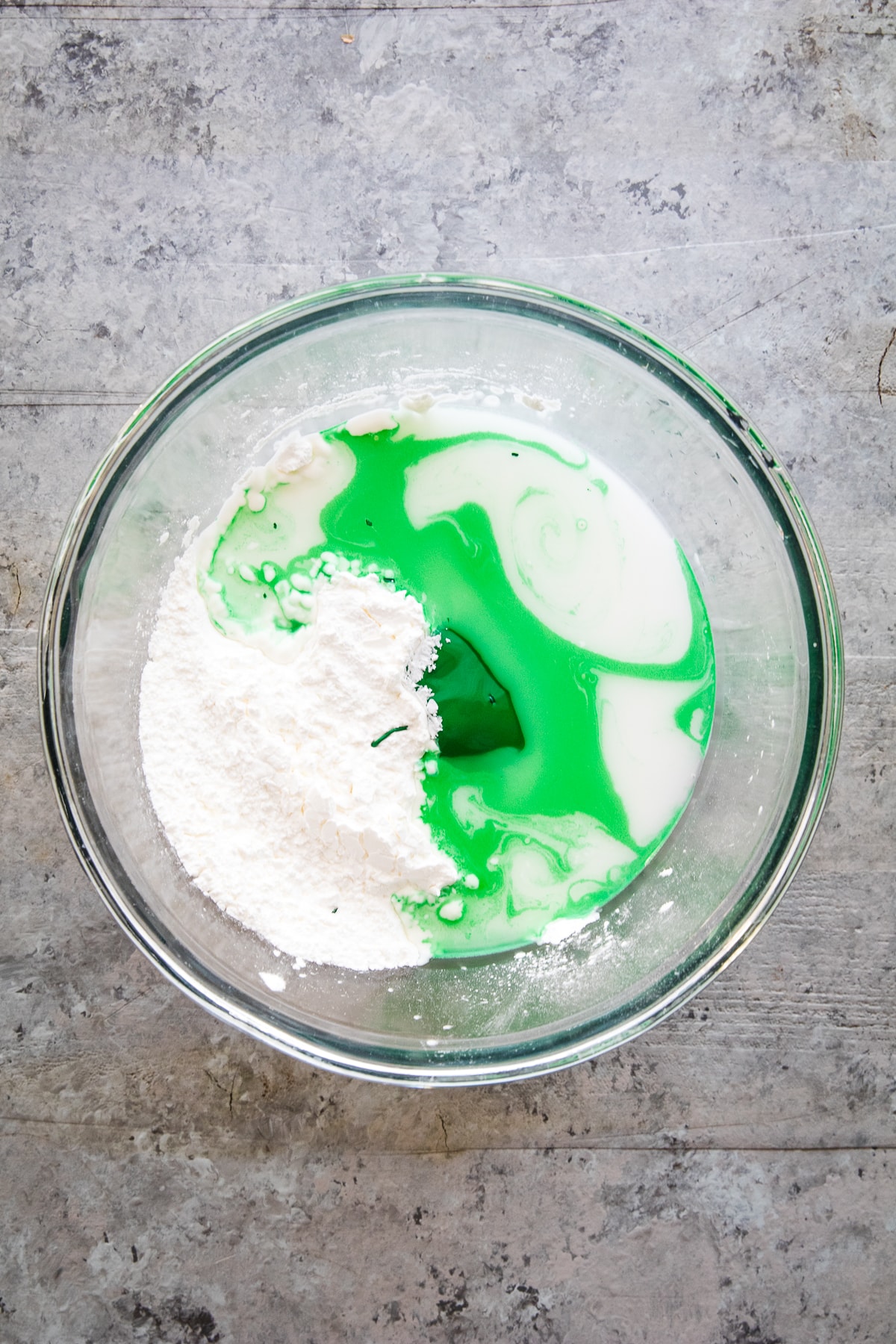 Overhead image of glass bowl with Oobleck Ingredients