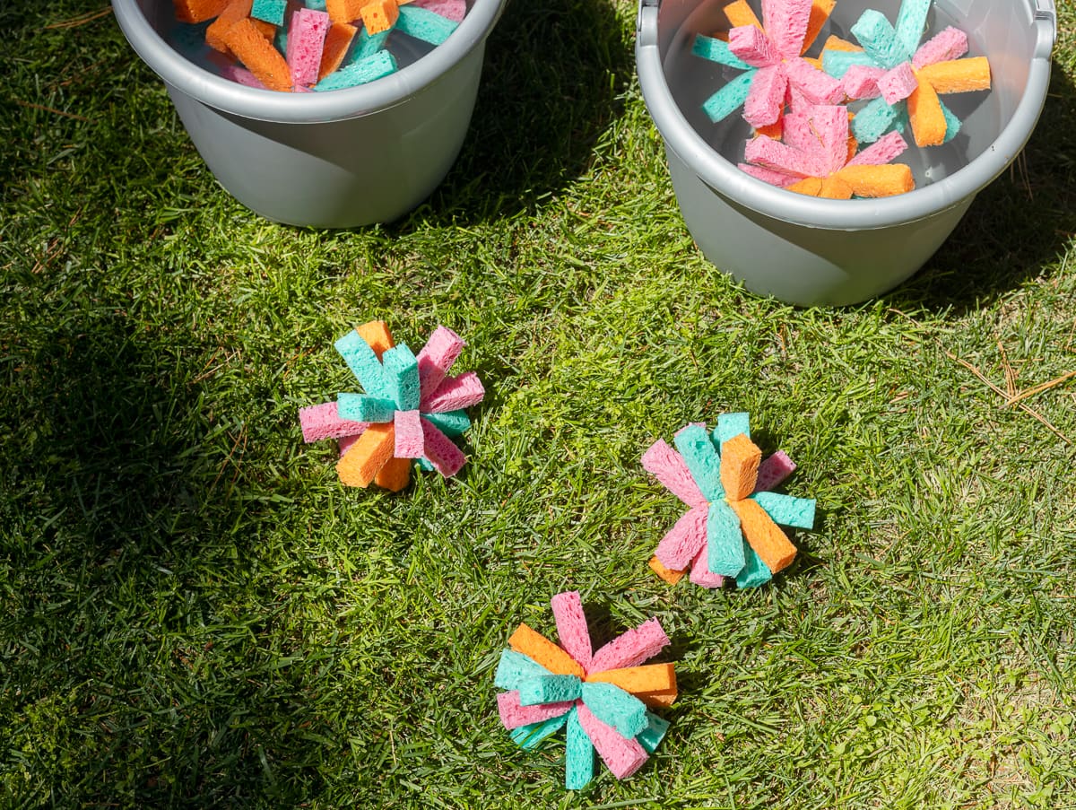 Sponge water bombs laying in the grass