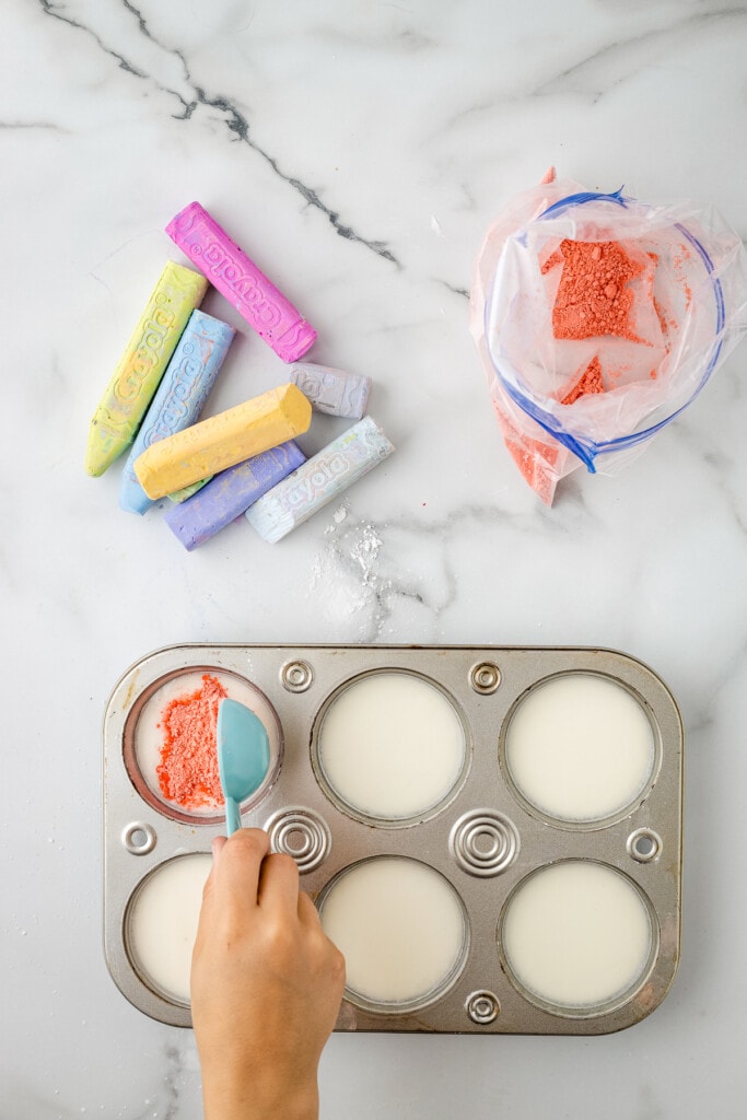 Adding crushed sidewalk chalk into cornstarch mixture