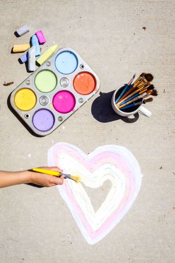 Sidewalk Chalk Paint being paint on driveway