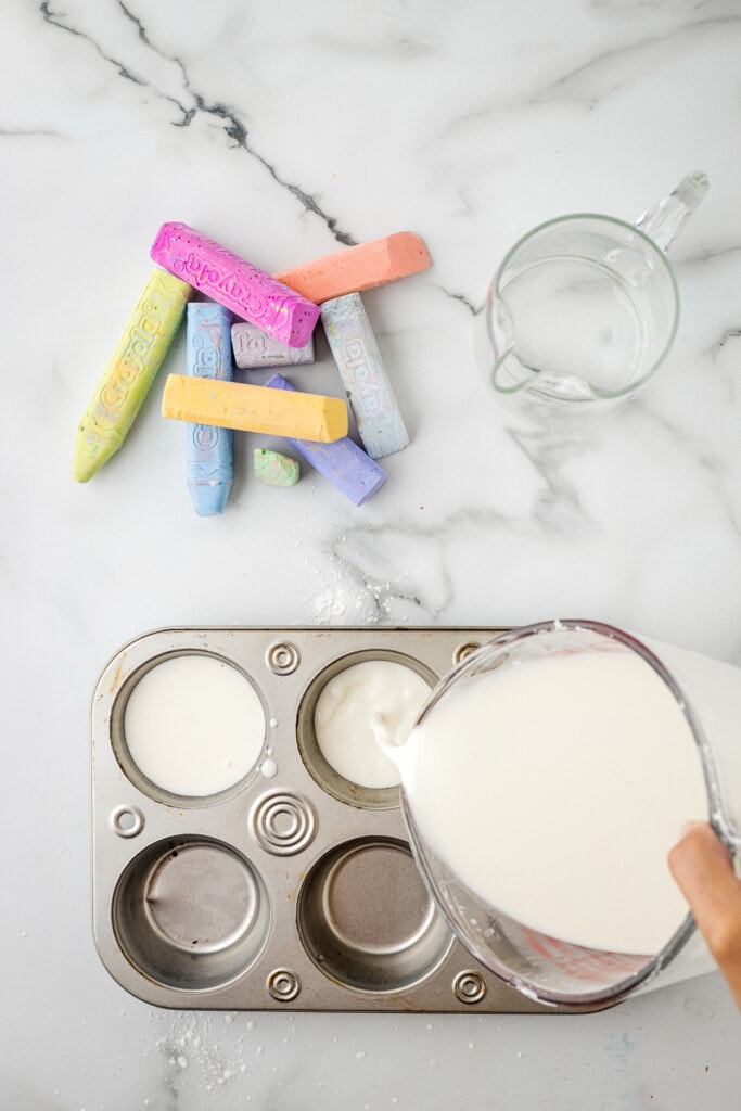 Pouring water and cornstarch mixture in muffin tins