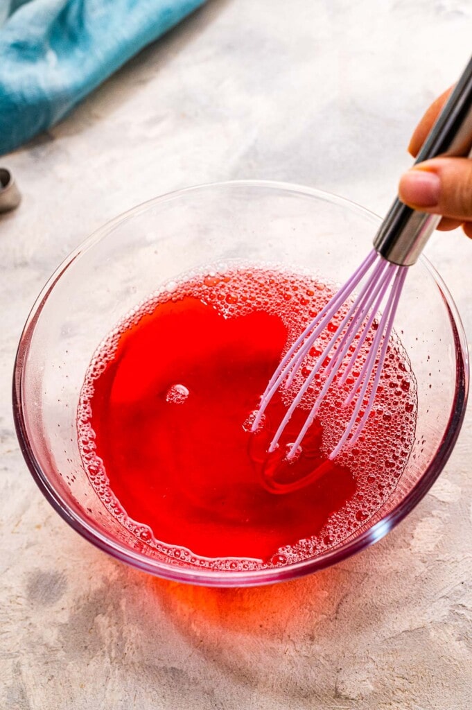 Stirring mixture for Jell-O In glass bowl
