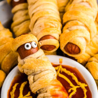 Mummy Hot Dog dipped in ketchup