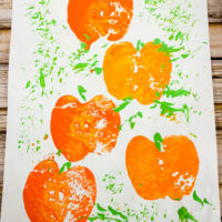 Pumpkin Painting on white paper made with apples