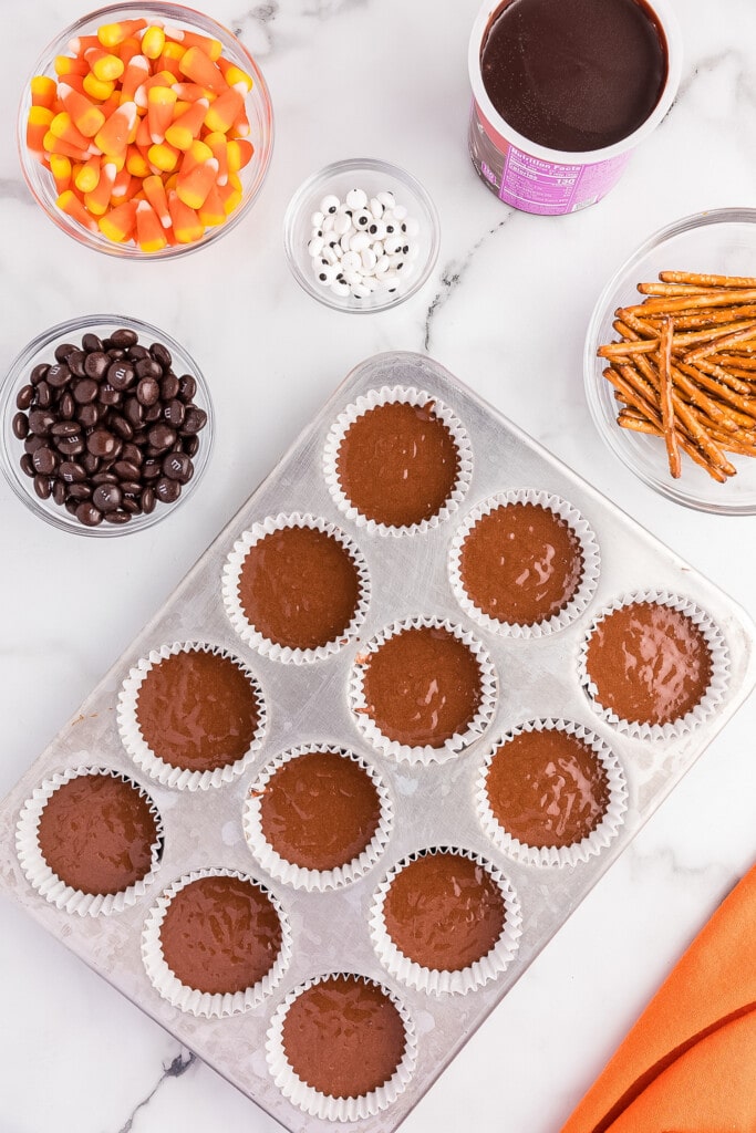 Overhead image of muffin tin with chocolate cake batter