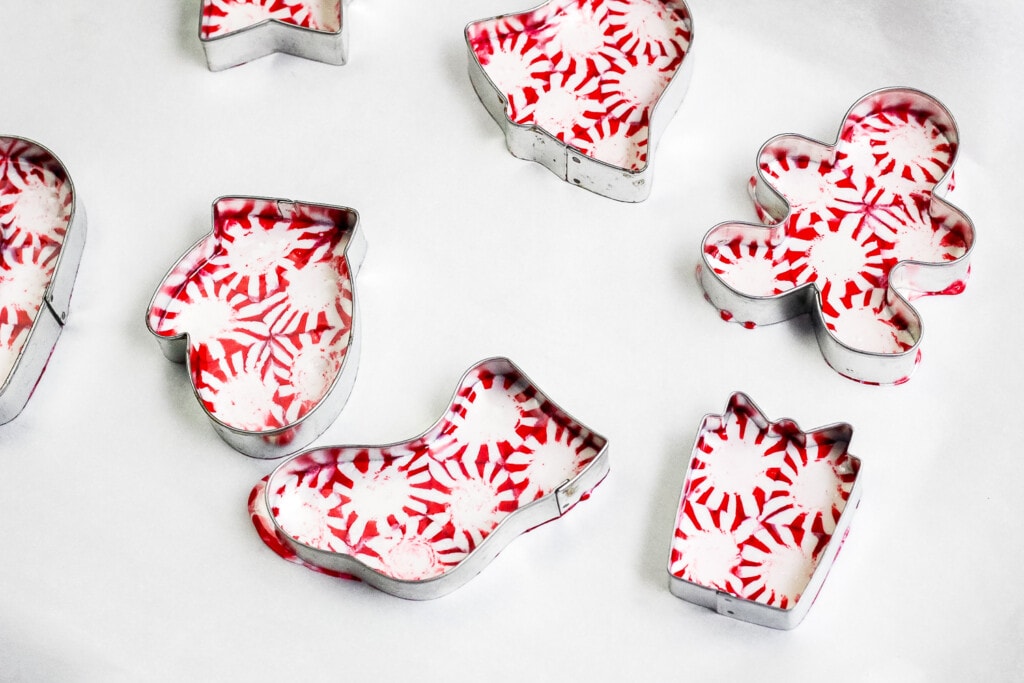Melted cookie cutter with peppermint candies in them