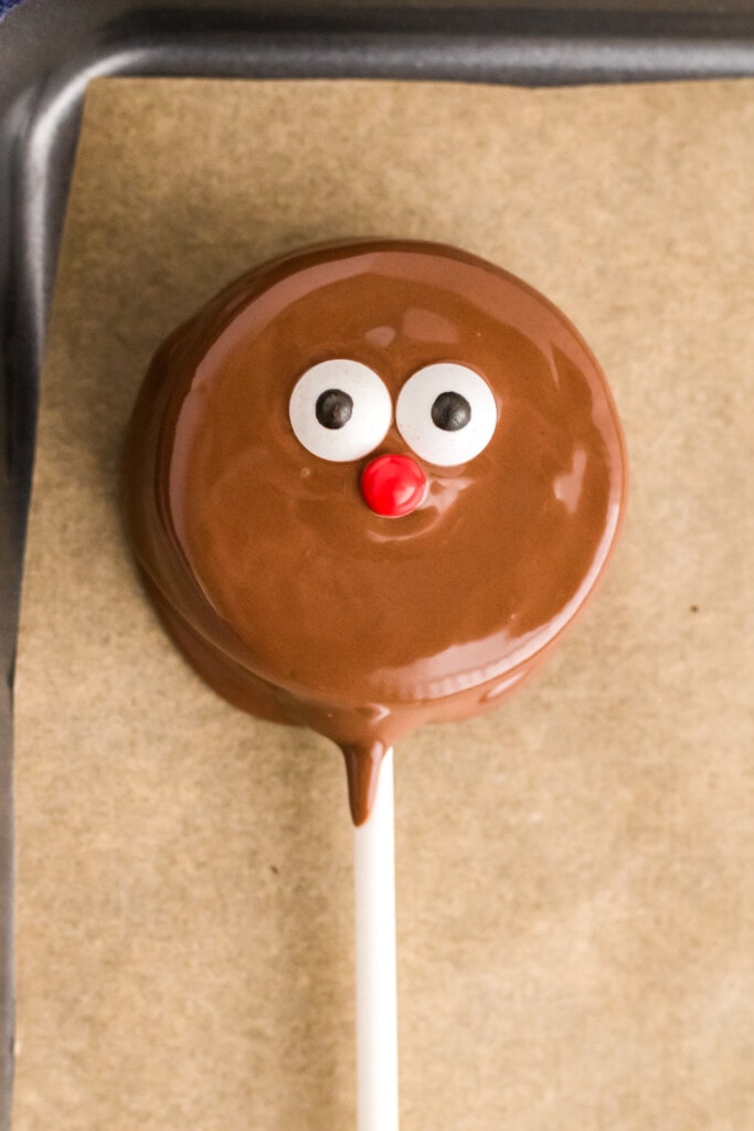 Reindeer Oreo Pop laying on parchment paper