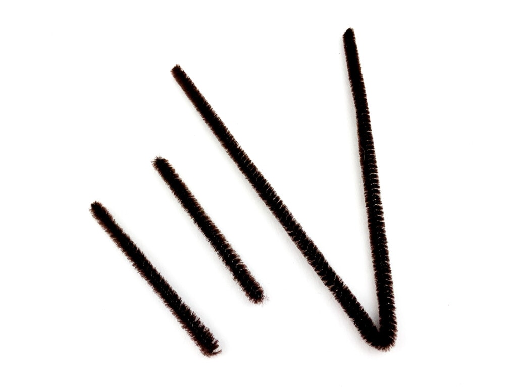 Brown pipe cleaners on white background