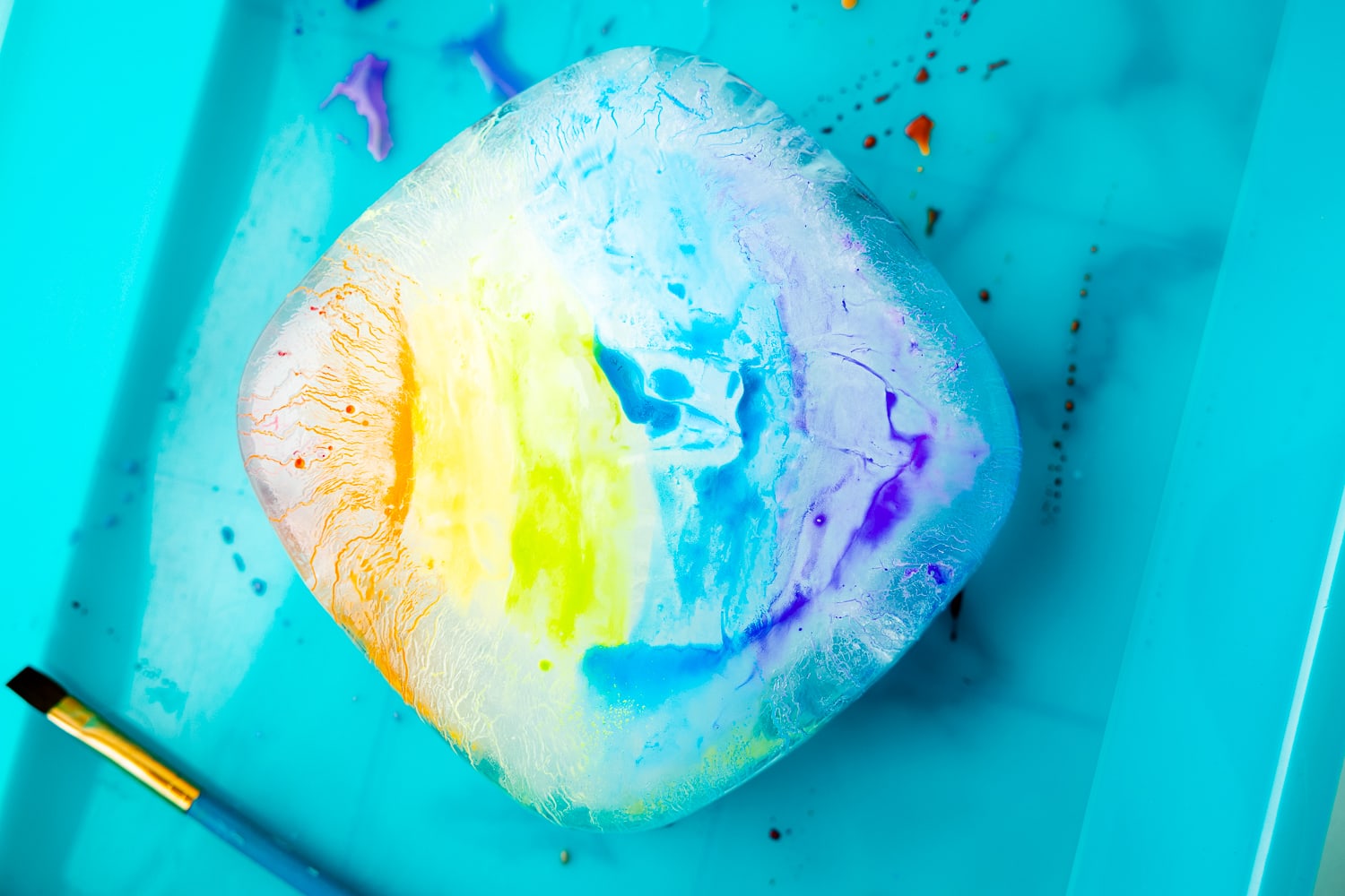 Melting ice block that's painted with watercolors