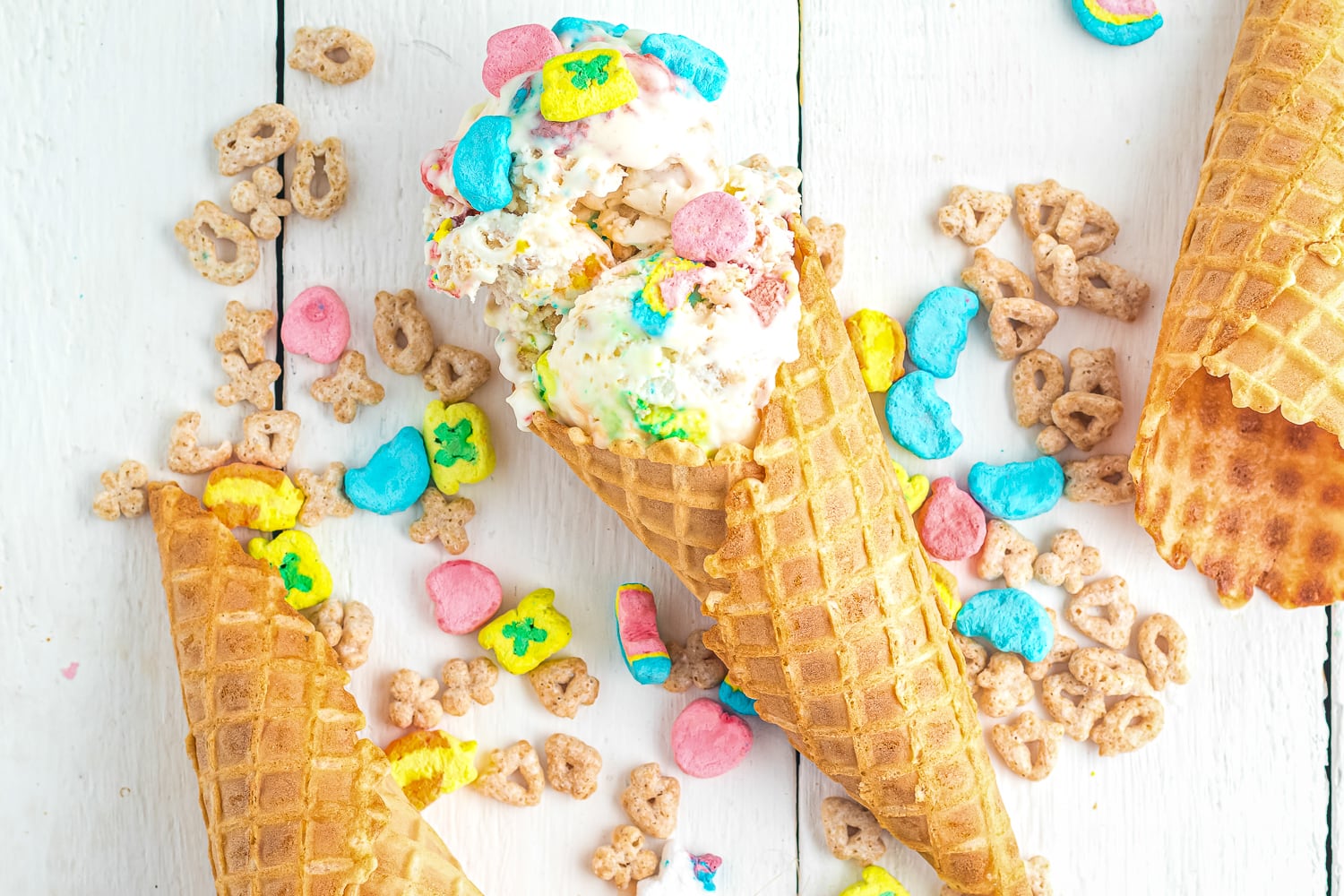 Overhead image of lucky charms ice cream in cones laying down
