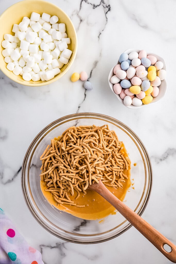 Bowl with melted butterscotch chips, peanut butter and chow mein noodles