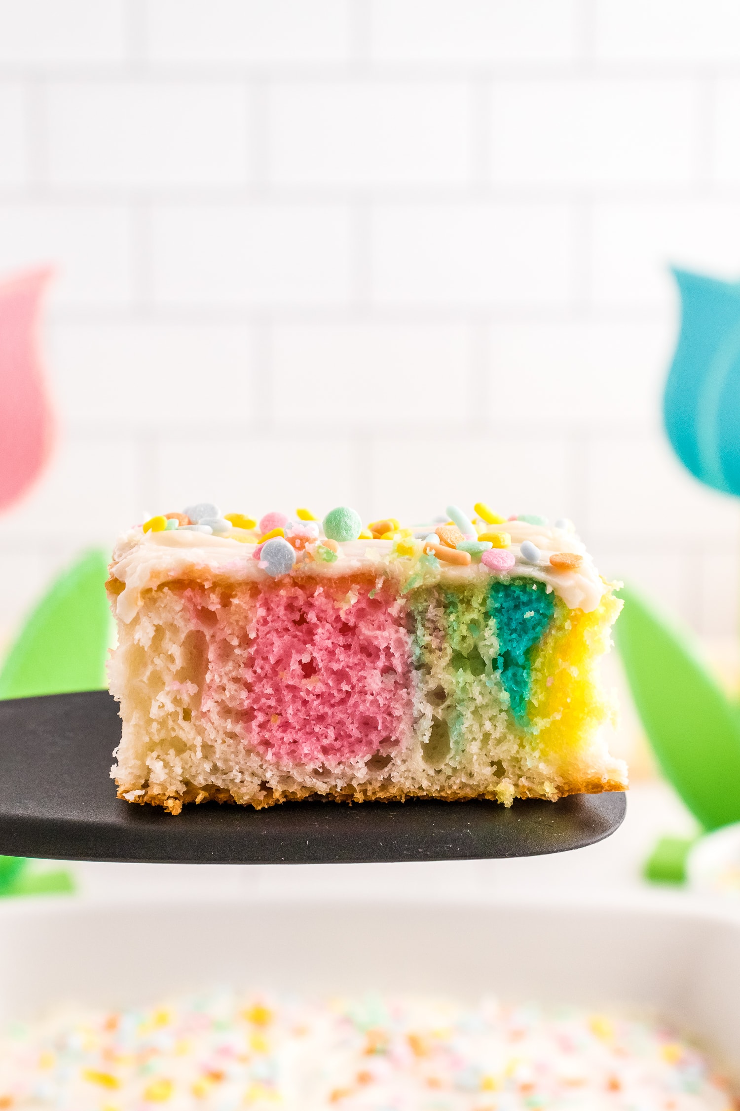 Spatula holding piece of Swirled Easter Cake