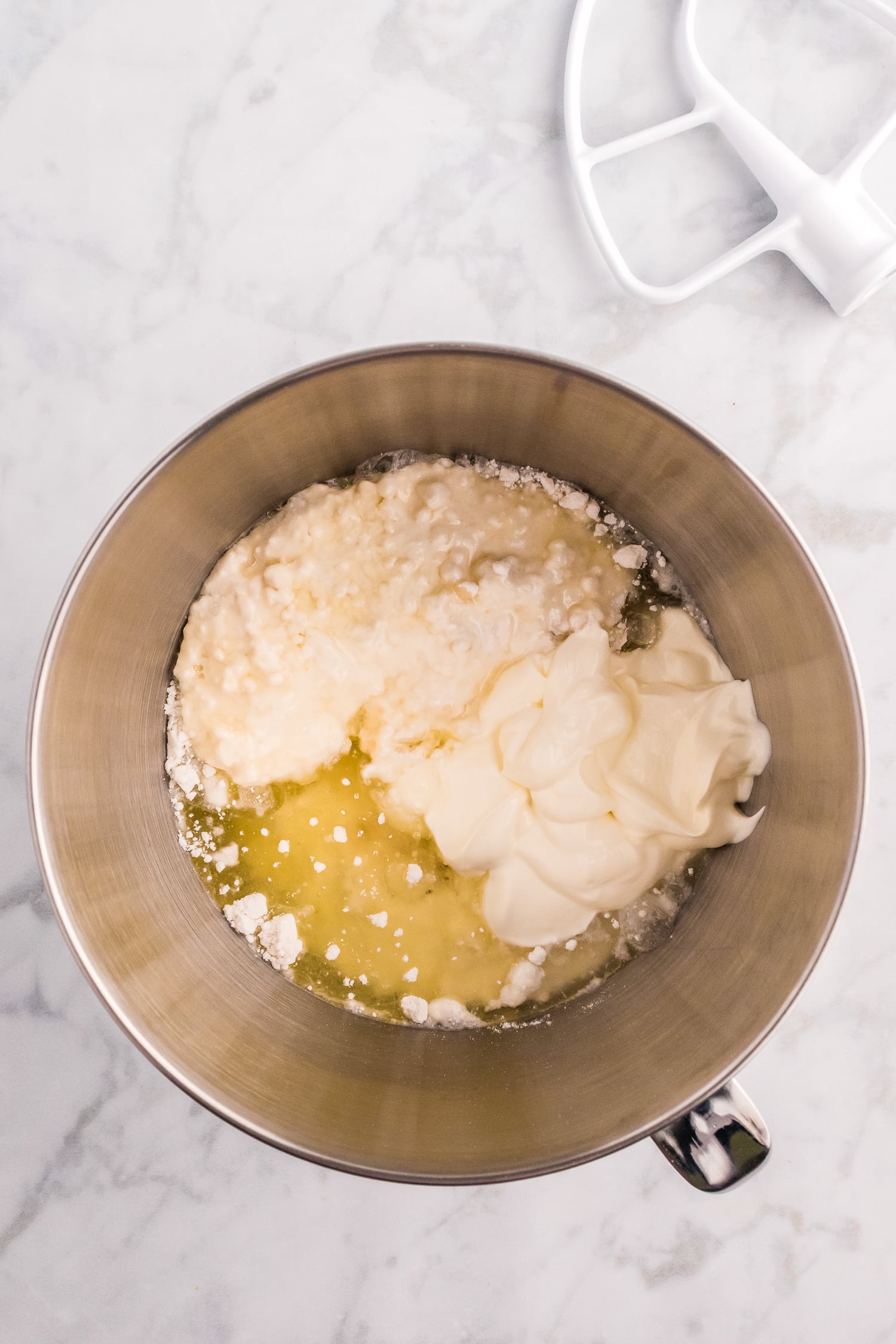 Mixing bowl with ingredients for vanilla cake