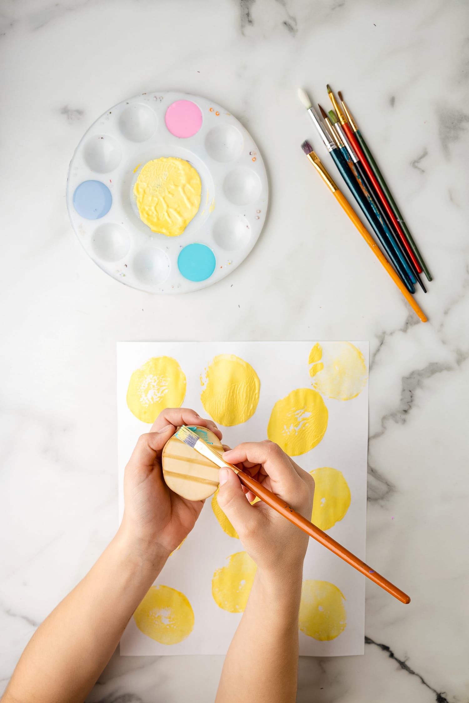 Painting a potato stamp different colors