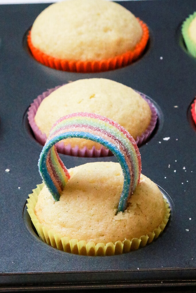 Rainbow candy on top of a vanilla cupcake