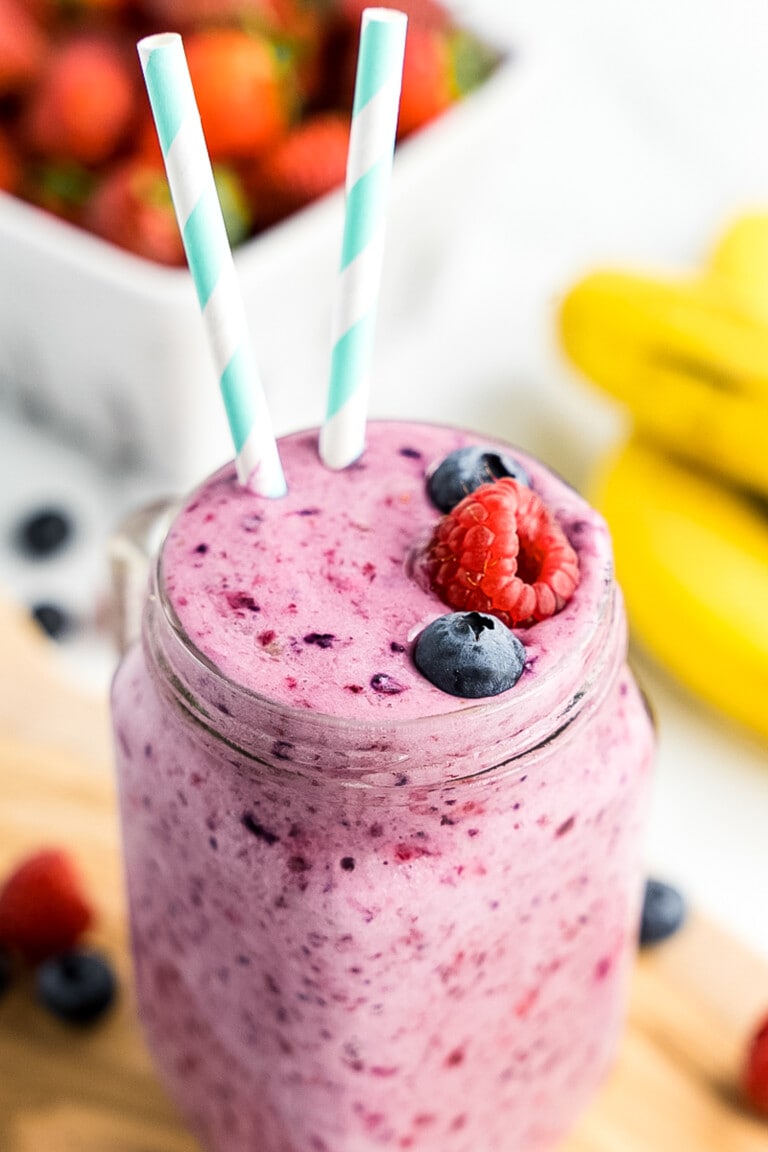 Mason jar with mixed berry smoothie in it