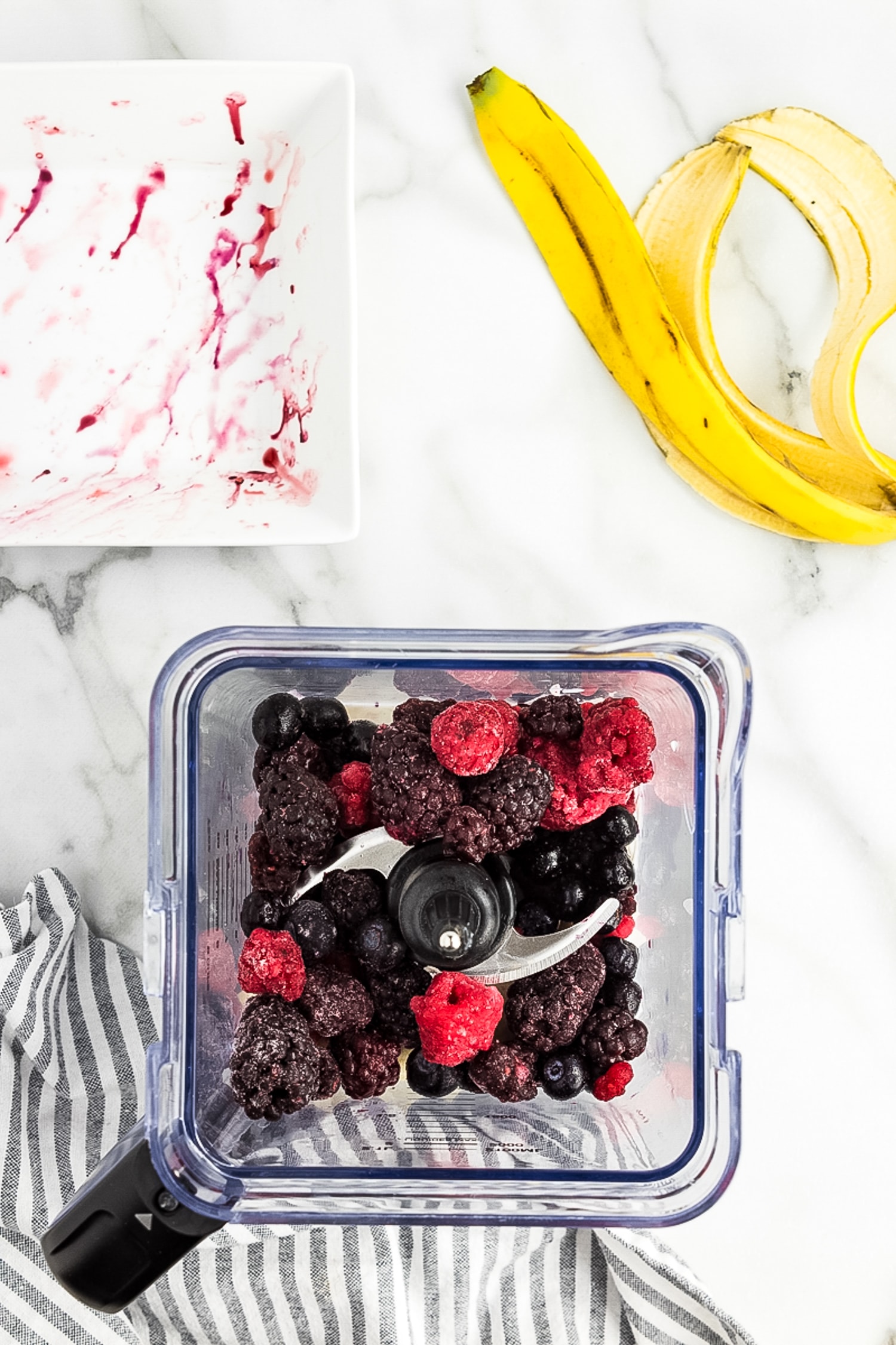 Overhead image of mixed berries in blender