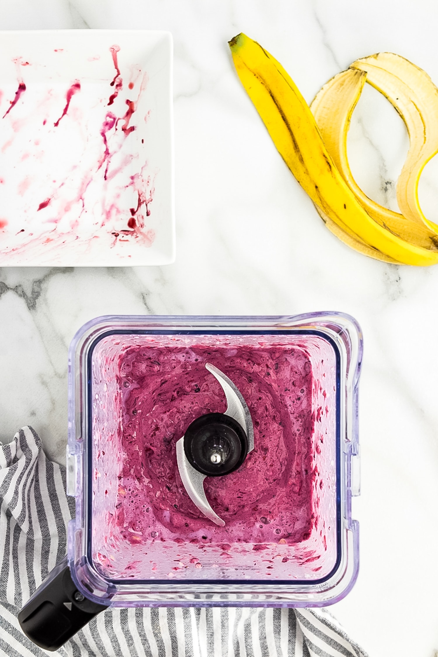 Overhead image of berry smoothie blended in blender