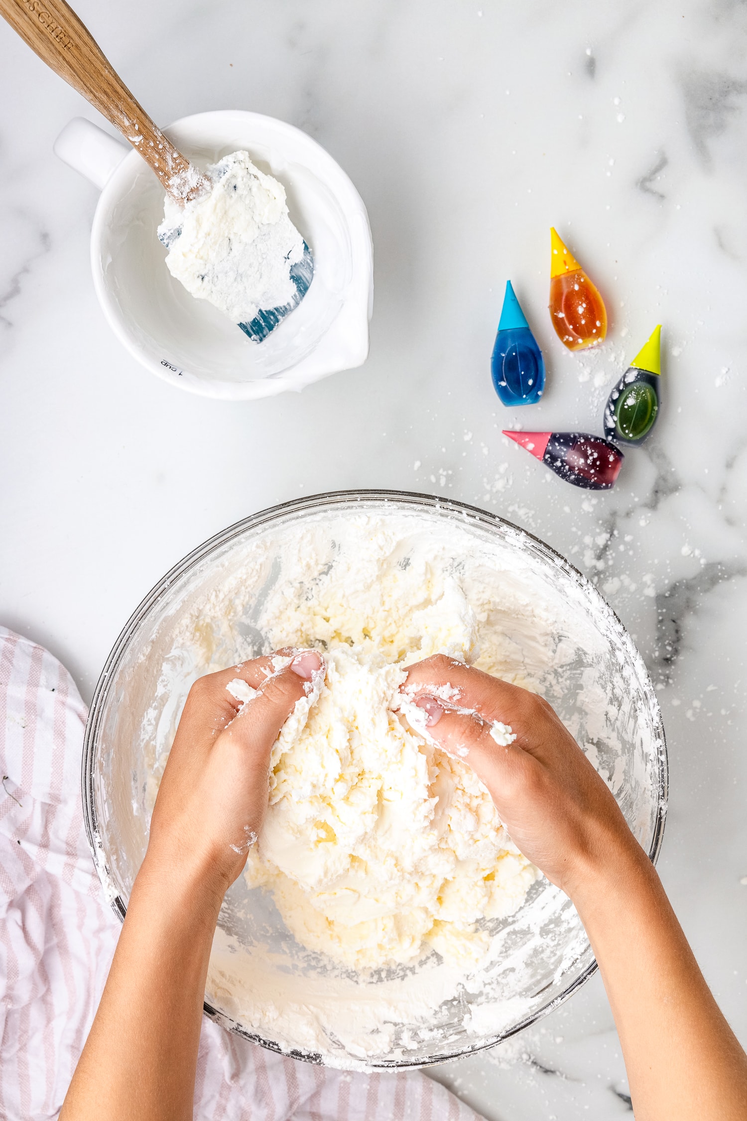 Kneading cloud dough in bowl