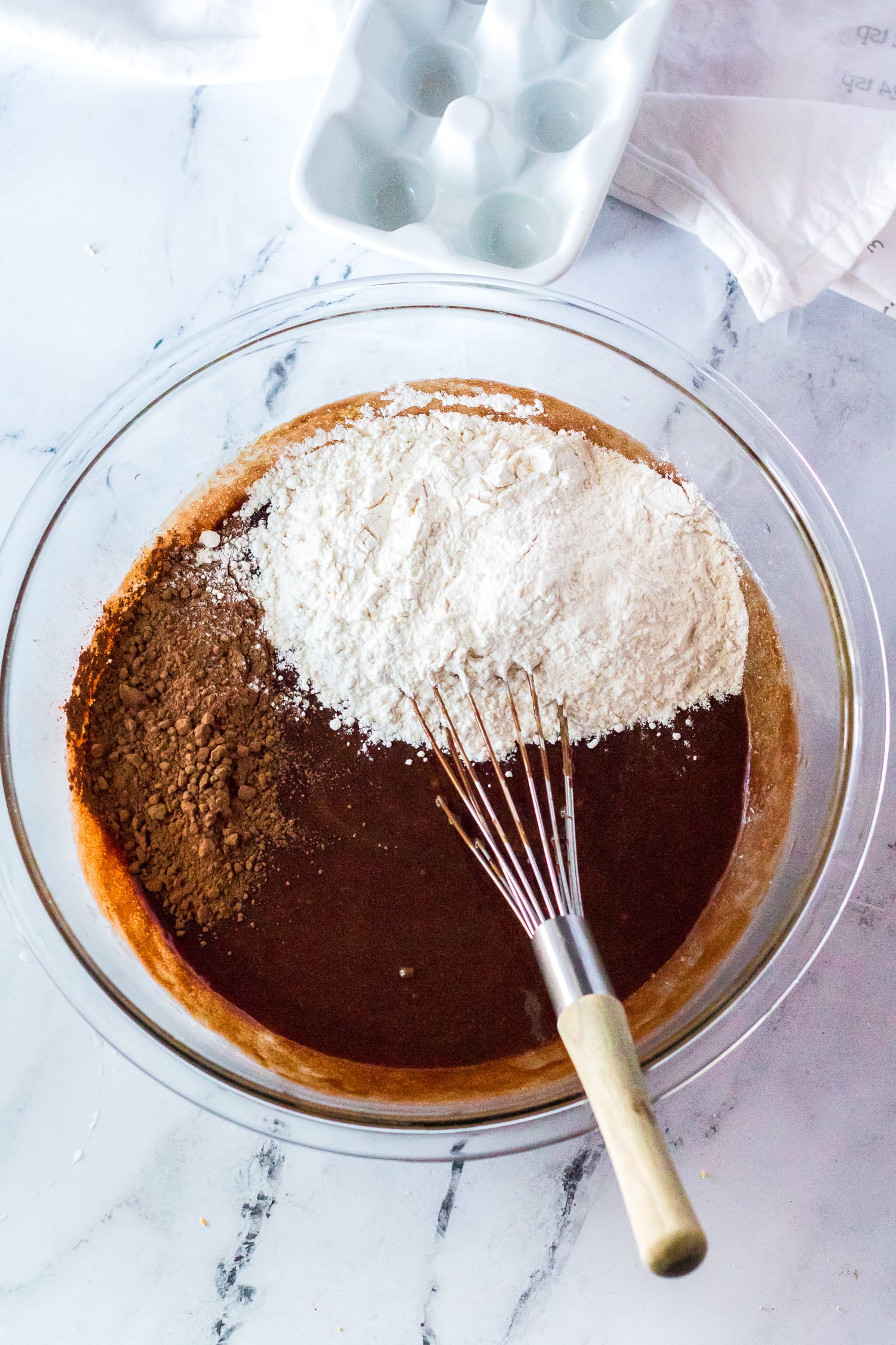 Stirring flour into brownie batter