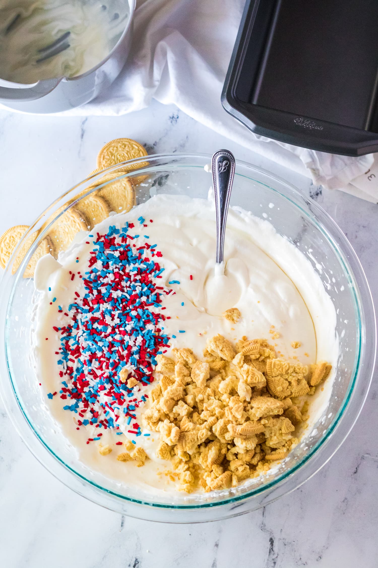 Ice cream base, sprinkles and crushed Golden Oreo Ice cream in bowl