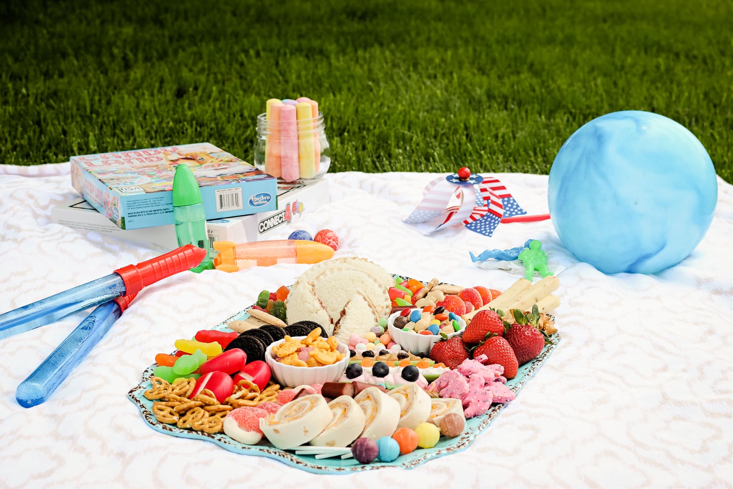 Kids Summer Snack Board on picnic blanket