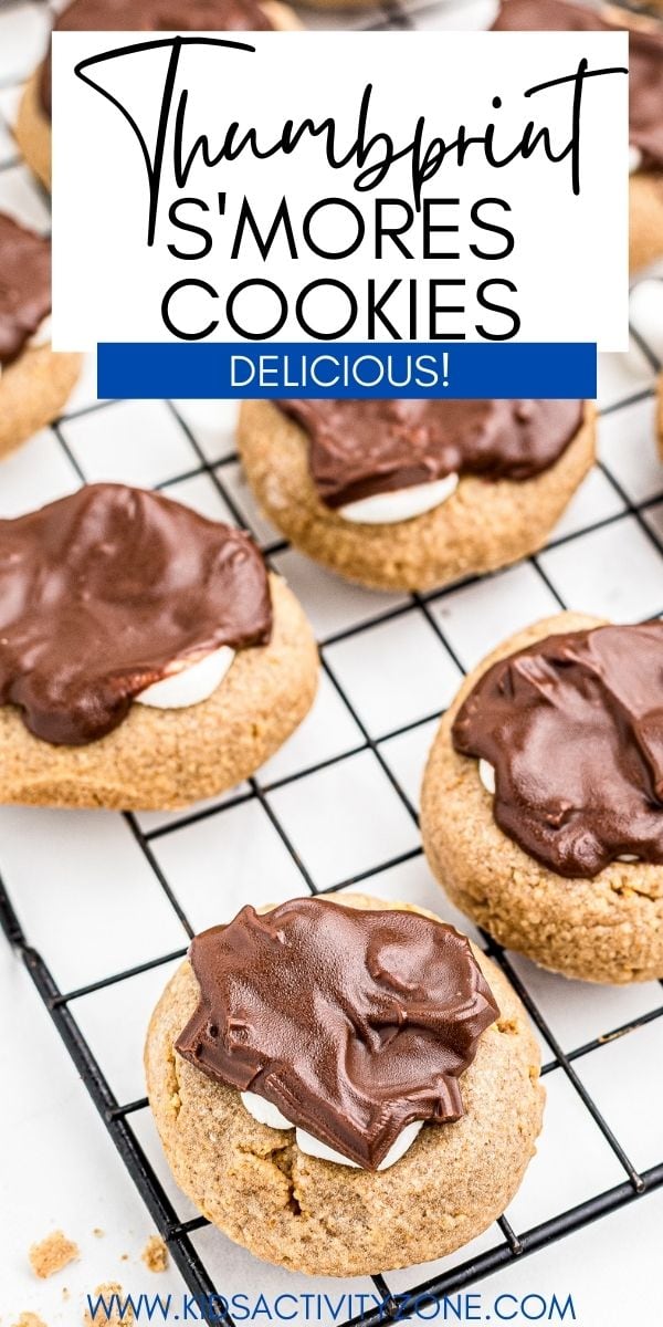 Thumbprint S'mores Cookies start with a graham cracker cookie and is topped with marshmallow and chocolate. The perfect treat when you are craving a s'more or just because. Make these easy s'mores cookies today.