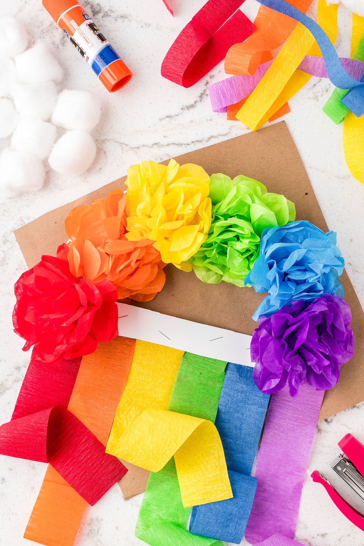 Tissue paper streamers on rainbow craft