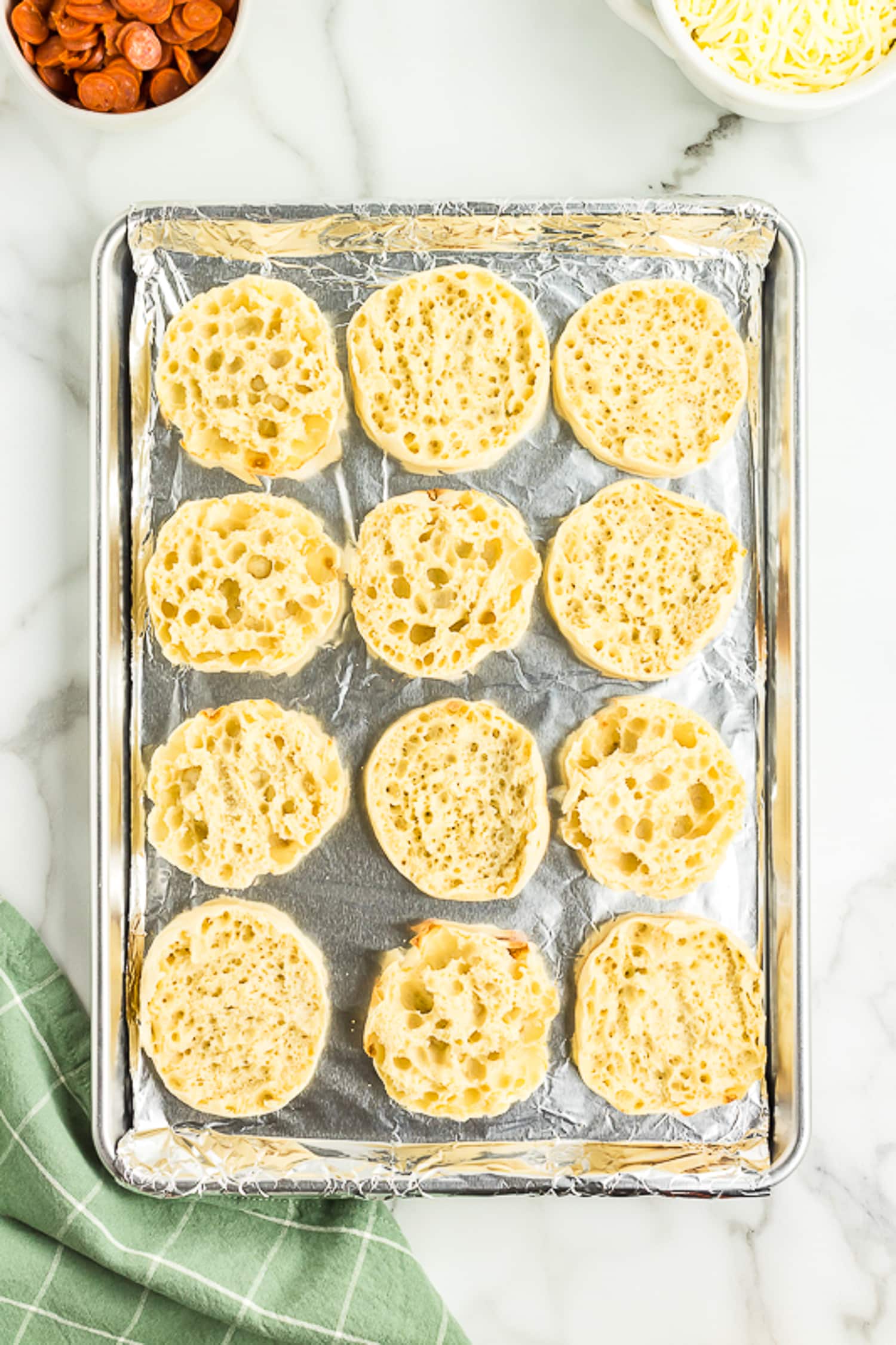 Sheet pan with English muffins split open