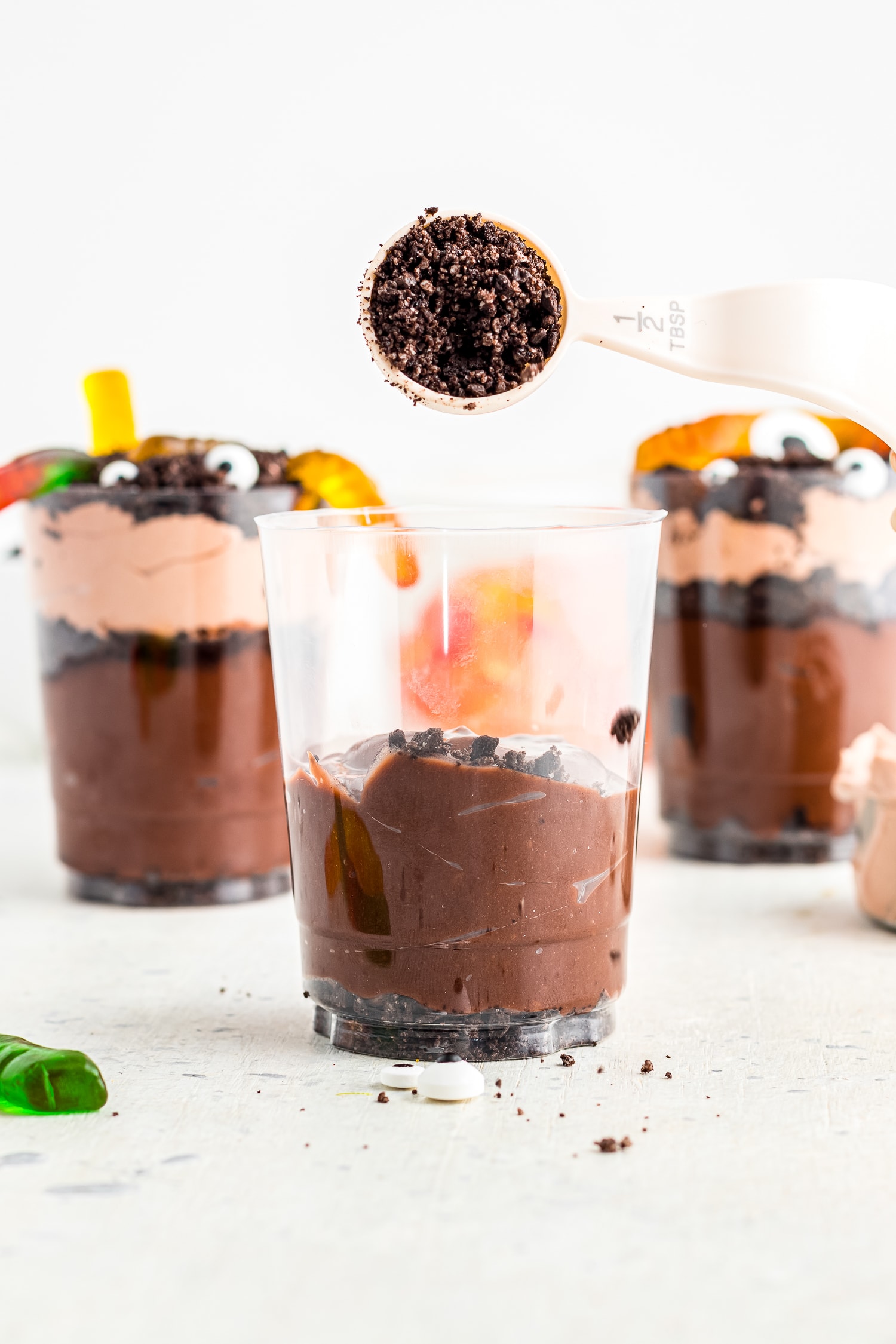 Plastic cup with chocolate pudding on bottom