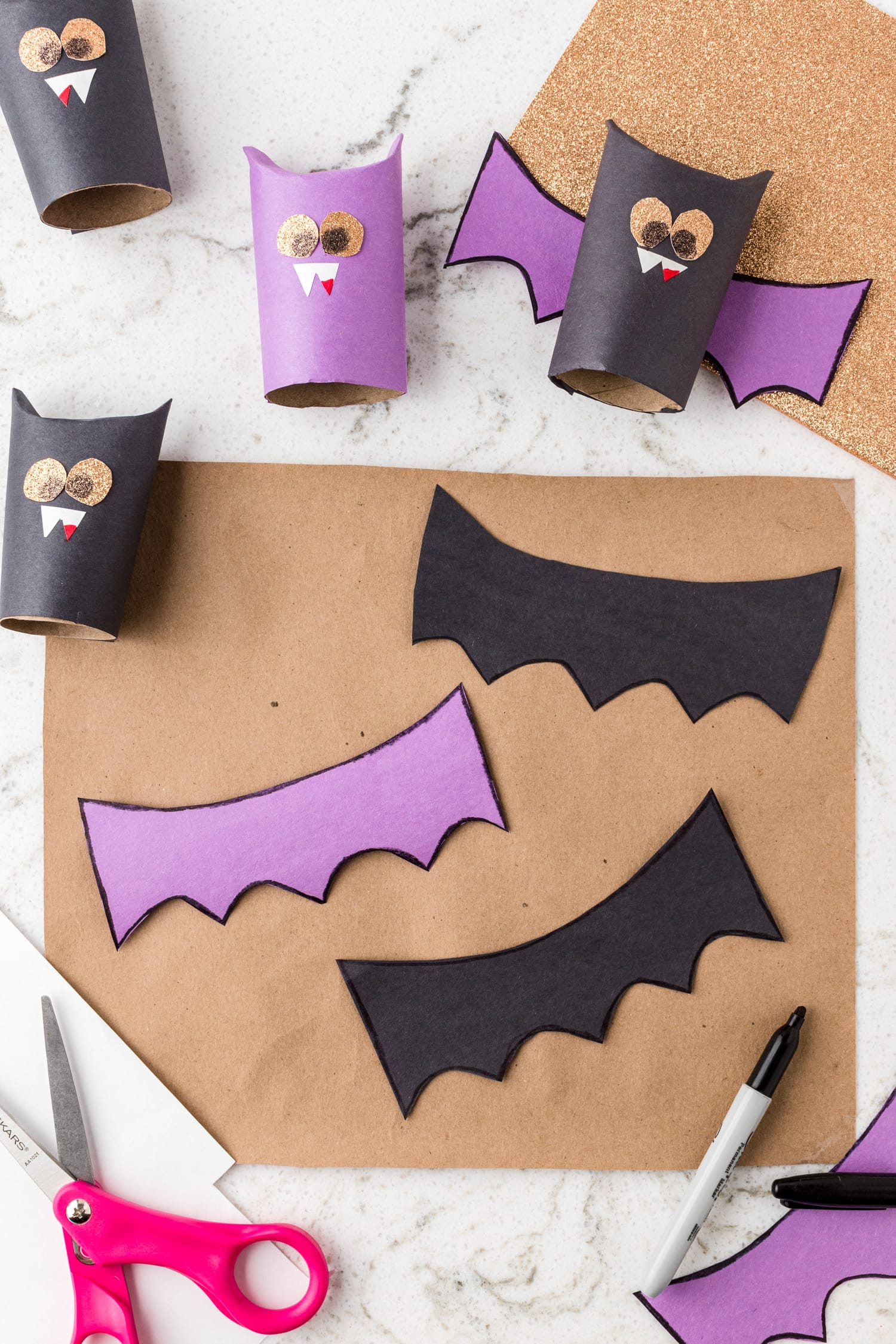 Purple and black bat wings made of construction paper