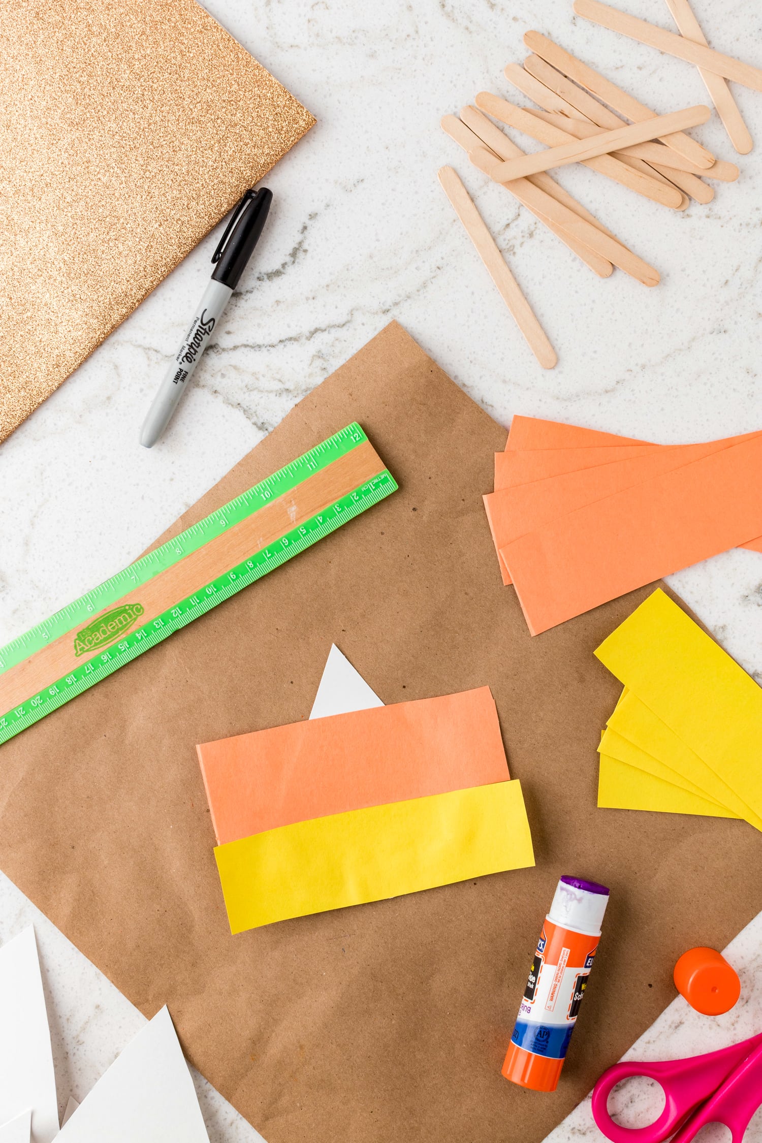 Strips of construction paper for candy corn craft