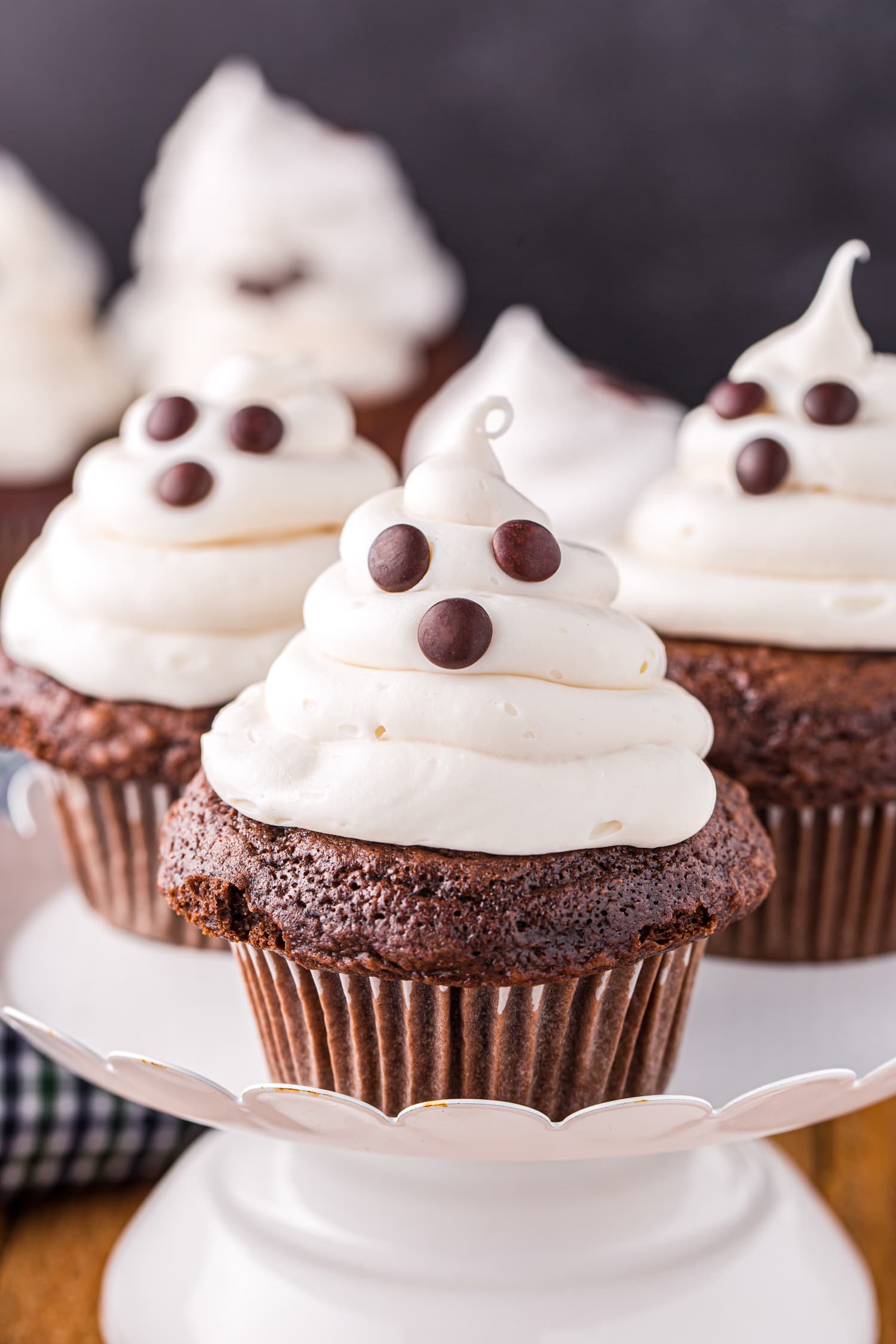 Ghost cupcakes on white cake platter