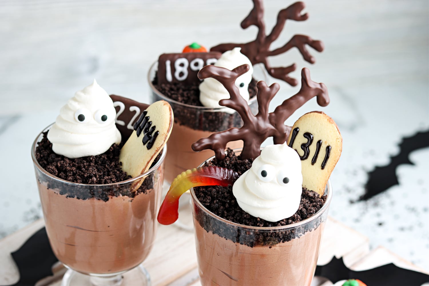 Cups of ghosts in the graveyard pudding cups dessert