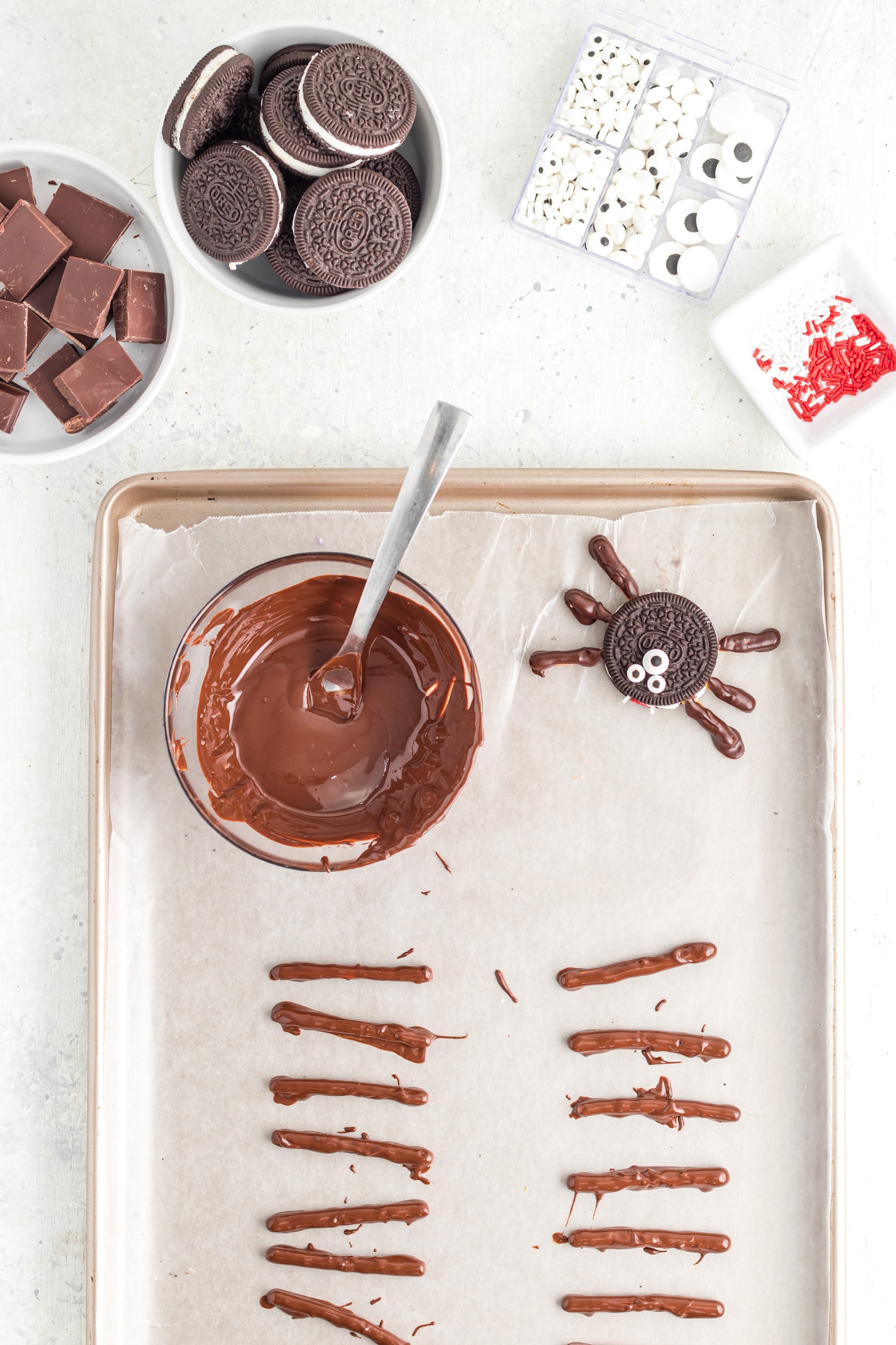 Chocolate dipped pretzel sticks on sheet pan