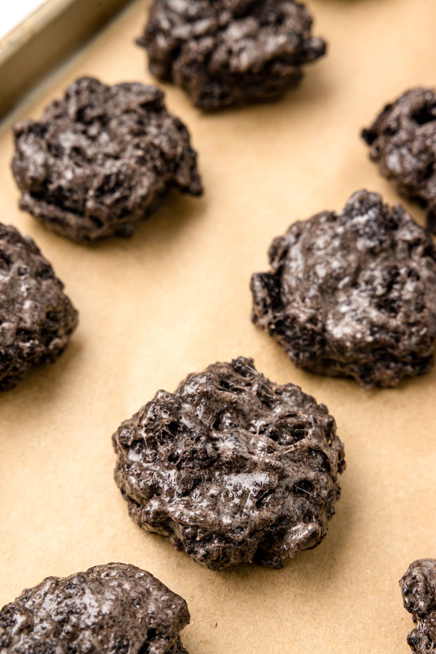 Lump of Coal Cookies on a sheet pan with parchment paper